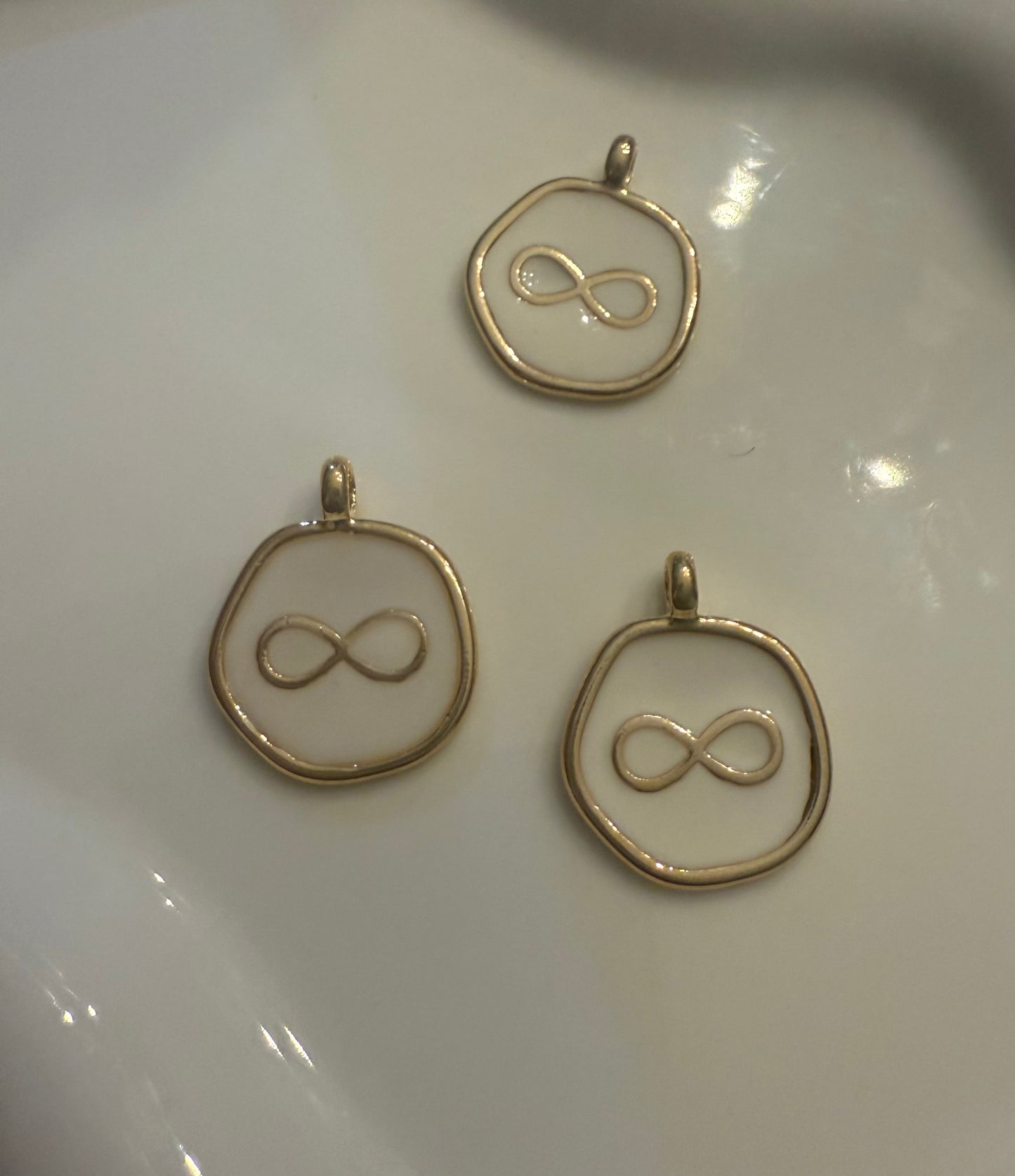 White Infiniti pendant