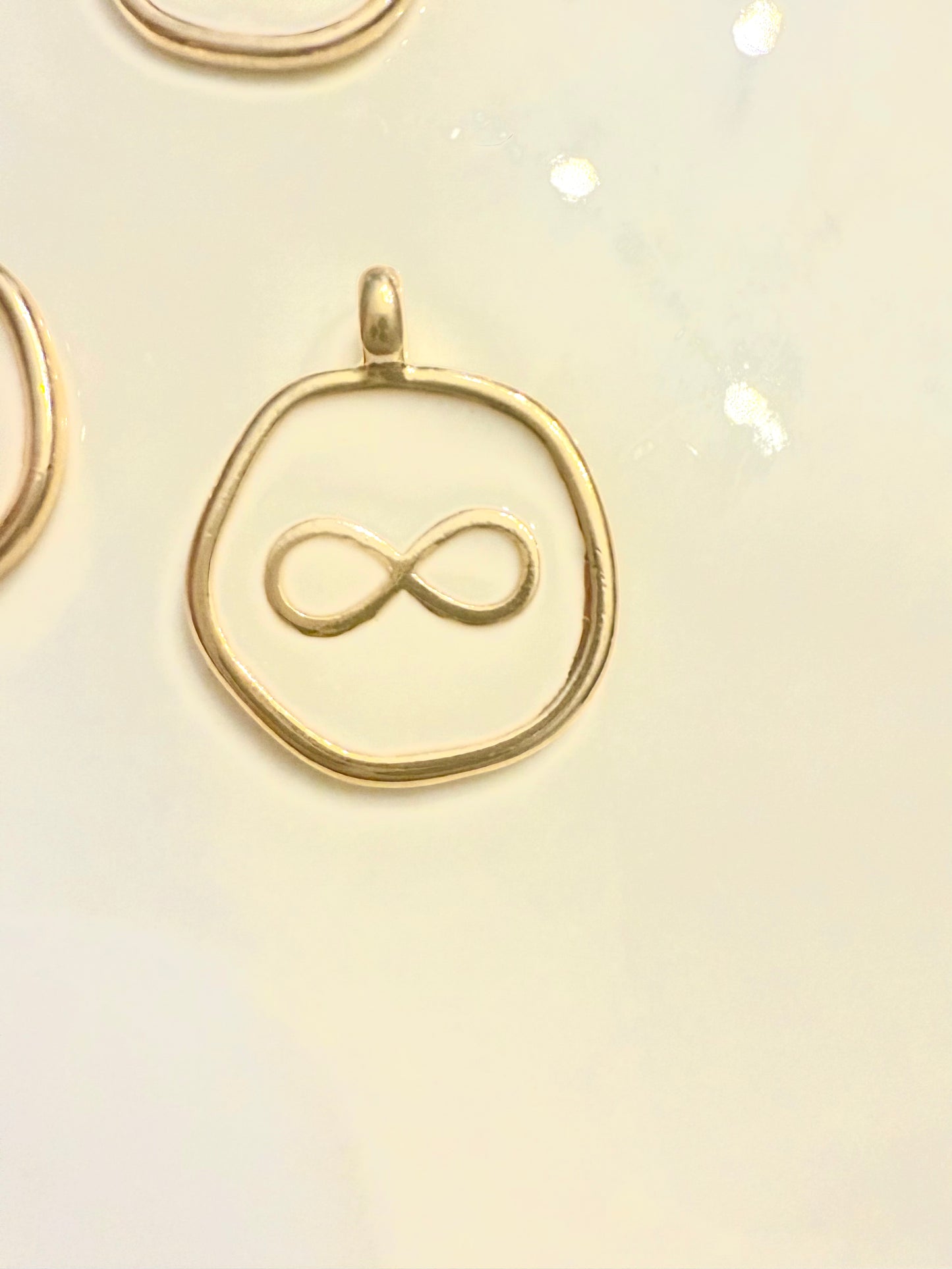 White Infiniti pendant